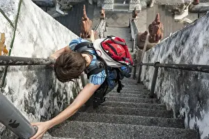 Category Buddhism Prints: Woman climbing the stairs at Wat Arun