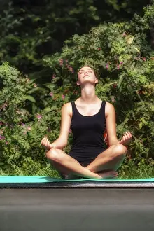 Category Buddhism Prints: Woman doing yoga outdoors