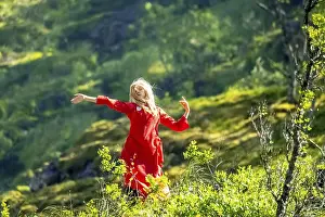 Woman dressed in red is a Huldra