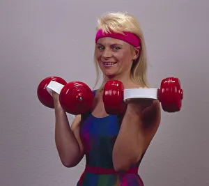 Woman with dumbbells