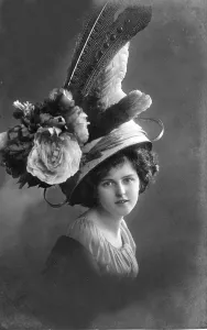 Woman with giant flowers on her hat
