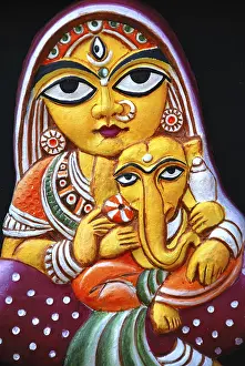 Woman with lord Ganesha models