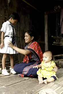 Woman making her child ready for school