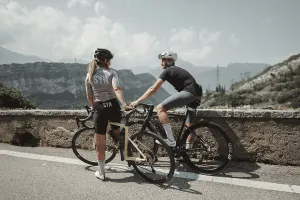 Woman and man cycling on Lake Garda in Italy