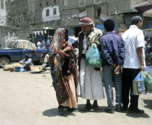 A woman and a man talking in the old town of Sanaa, UNESCO World Heritage Site, Sanaa, Yemen, Asia