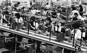Many woman and a few men work at jobs at Standard Elektrik Lorenz (SEL)