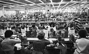 Many woman and a few men work at jobs at Standard Elektrik Lorenz (SEL)