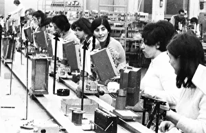 Many woman and a few men work at jobs at Standard Elektrik Lorenz (SEL)