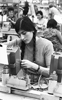 Many woman and a few men work at jobs at Standard Elektrik Lorenz (SEL)