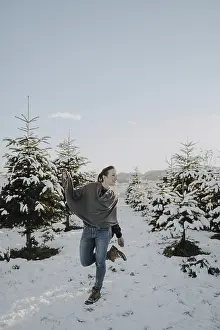 Woman in poncho in winter landscape