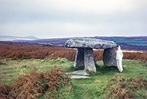 Woman in front of the prehistoric dolmen Lanyon Quoit, Morvah, Cornwall, England, UK 1967
