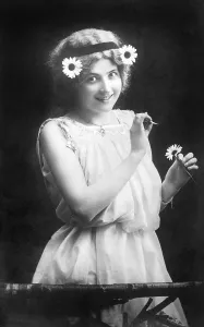 Woman pulling petals from a flower