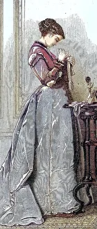 Woman at sewing work, in a long dress after the fashion around 1869 in France