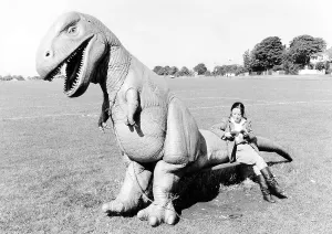 Woman sitting on Dino, England, Great Britain