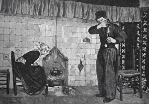 Woman sitting in front of a stove while a man blows his nose in embarrassment