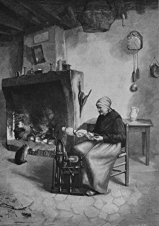 Woman spinning wood with spinning wheel