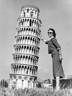 Woman stabilizing the Leaning Tower of Pisa