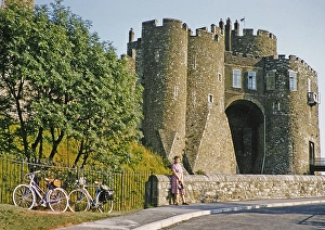 Woman standing next to two bicycles at Constable's Tower, Dover Castle, Dover, Kent, England, Great Britain, early 1960s
