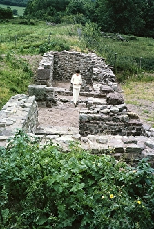 Woman standing in Y Gaer south gatehouse of the Roman fort, AD75-AD140, Brecon, Brecknockshire, Powys, Wales, UK 1967