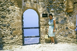Woman tourist standing in Saint Hilarion Castle, Kyrenia or Girne, Northern Cyprus, Cyprus, Europe 1973, Europe