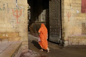 Woman walking through fort gate