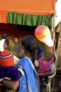 Women show their babies sights at fair in Konarak