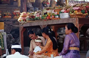 Women with child and offerings