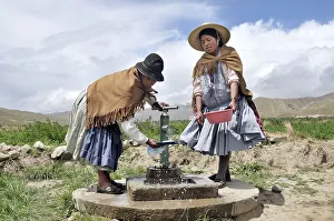 Women doing dishes at the well
