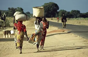 Women with payloads, Malawi, Africa
