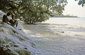 Two women sitting in the water at the famous waterfall of Dunn's River Falls, Ocho Rios, Jamaica, 1970, Central America
