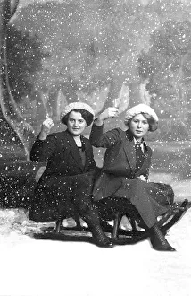 Two women with sledge and snow