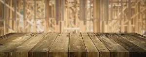 Empty wood table surface display background with construction theme behind