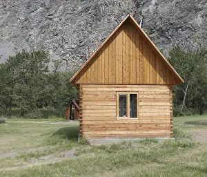 Framed Print : Wooden camping cabin near mountains