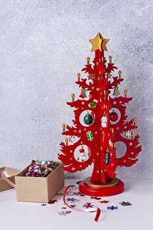 Wooden Christmas tree red and a box with toys