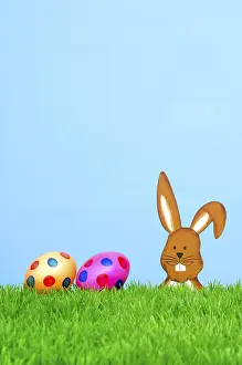 Wooden Easter bunny with coloured Easter eggs