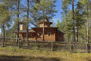 Wooden Nellim orthodox church in clear spring weather