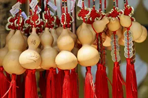 Wooden pumpkin bottles with red tassels symbolize good fortune and prosperity
