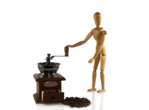 Wooden puppet grind coffee on a old machine