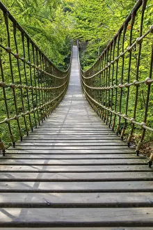 Wooden suspension bridge over a gorge