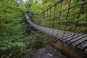 Wooden suspension bridge over a gorge