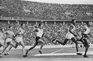 Woodruff, USA, 2nd from right, ran towards the finish of the 800 m run