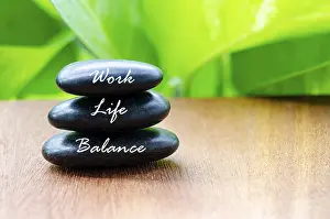 Work Life Balance text on black zen stones