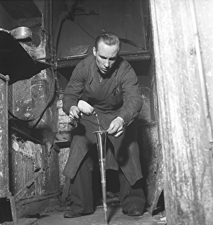 Workers in the 1940s. Interior of a mechanical workshop for musical instruments