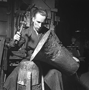 Workers in the 1940s. Interior of a mechanical workshop for musical instruments