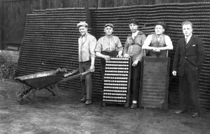Workers having a group photo, historical photo