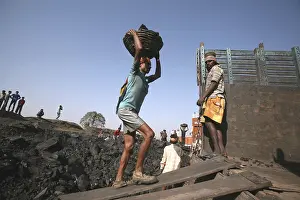 Workers loading coal from Coal mine in truck in Jharkhand