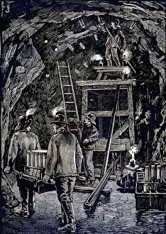 Workers position dynamite cartridges in underground tunnels in preparation for the blasting of Flood Rock