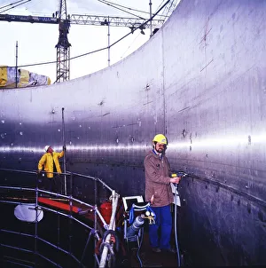 Workmen building a coal-fired power plant