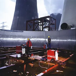 Workmen building a coal-fired power plant