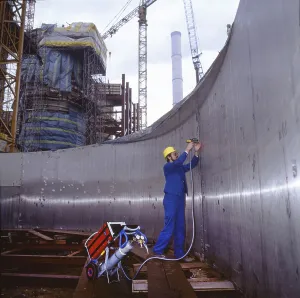 Workmen building a coal-fired power plant